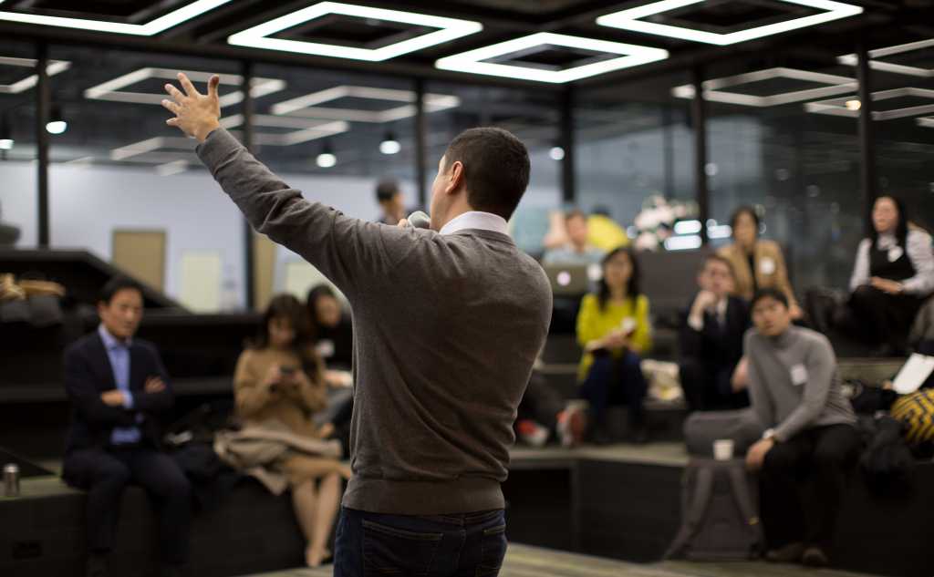 man gesturing during presentation